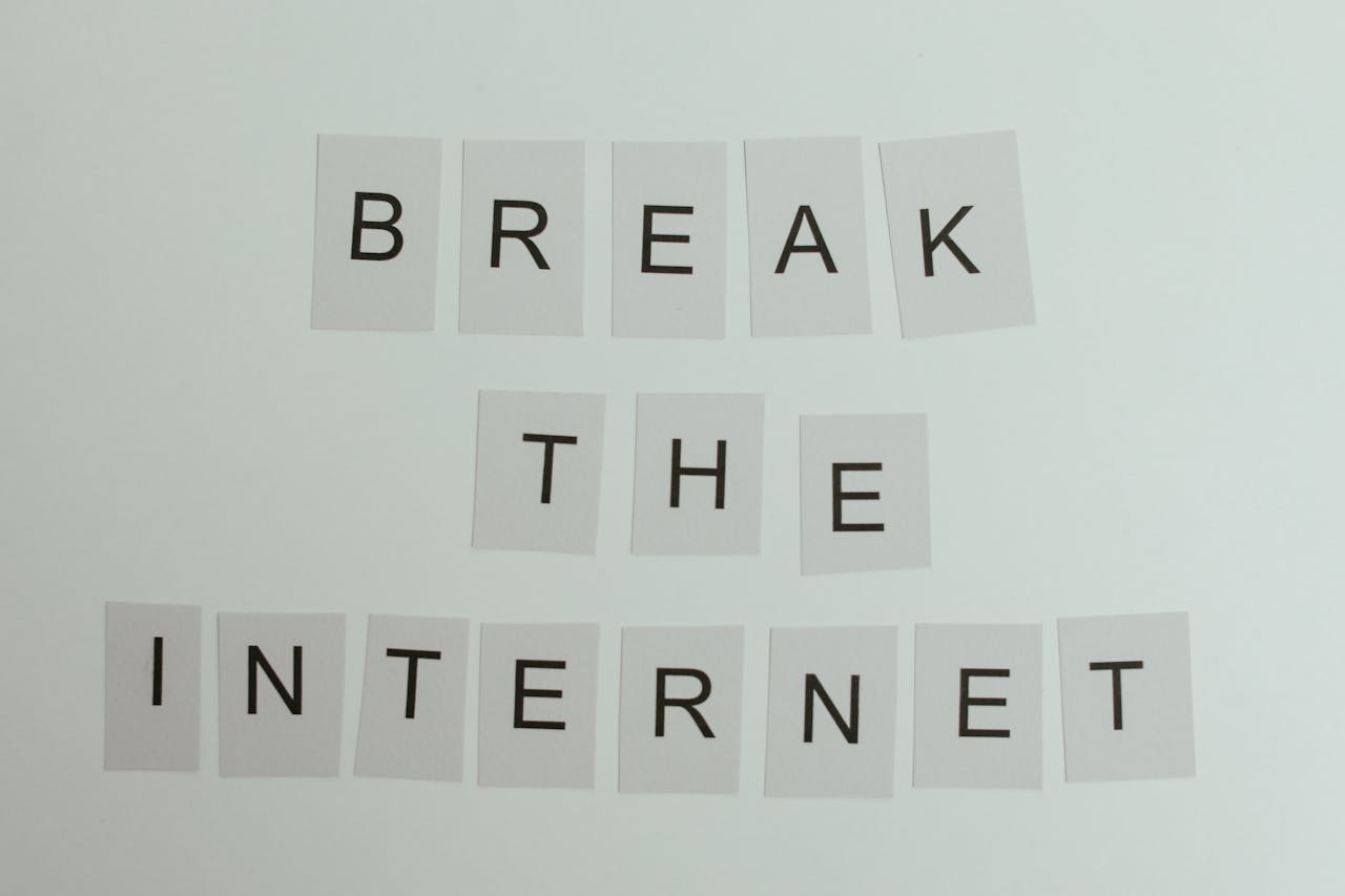 about-us Conceptual image with text 'Break the Internet' using letter cards on a light background.